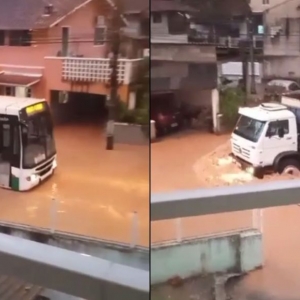 VÍDEO: Ônibus e carreta ignoram enxurrada e revoltam moradores